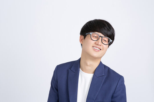 Young Asian Business man looking down and disappointing on white background