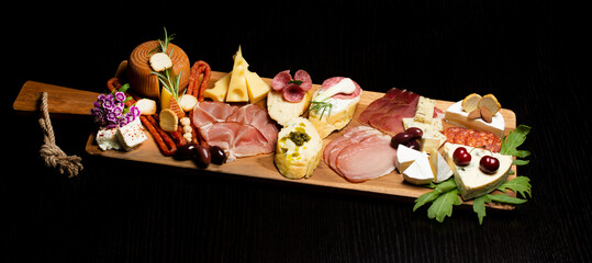 Appetizers table with differents antipasti, charcuterie, snacks and cheese. Buffet party. Top view,...