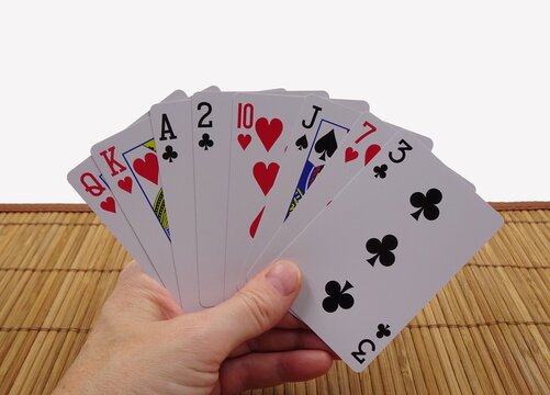 Playing cards in hand. Playing cards for a card game, for magicians, as a hobby...