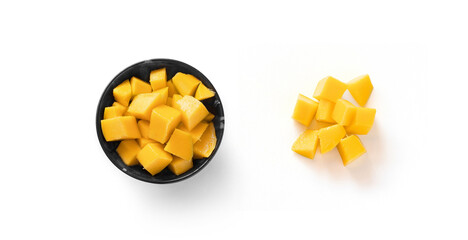 mango in black plate and diced mango on white background top view isolated