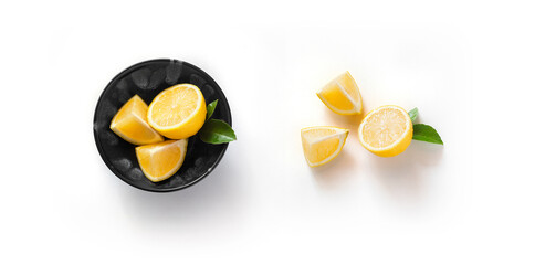lemon with slices and green leaf isolated on white background top view