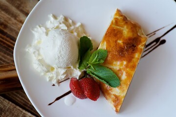 Strudel with filling. Delicious dessert pastries, decorated with fresh strawberries