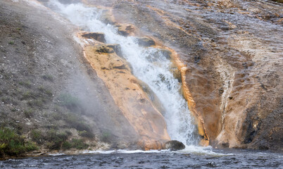 River and Hot spring Geyser with colorful water in American Landscape. Yellowstone National Park, Wyoming, United States. Nature Background