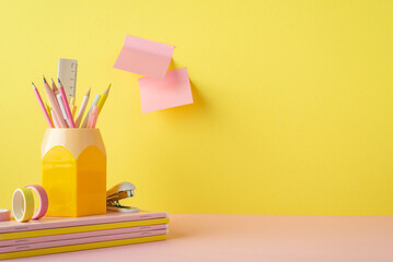 Back to school concept. Photo of pink and yellow stationery stack of notebooks stand for colour...