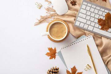 Autumn business concept. Top view photo of keyboard computer mouse cup of coffee on rattan serving mat notebooks pen binder clips yellow maple leaves and scarf on isolated white background