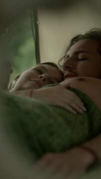 A young couple is waking up inside a camper in the morning