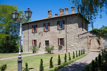 Facade of the old town hall building in Fortunago, one of the most charming villages of Oltrepò Pavese, Lombardia countryside, Italy.