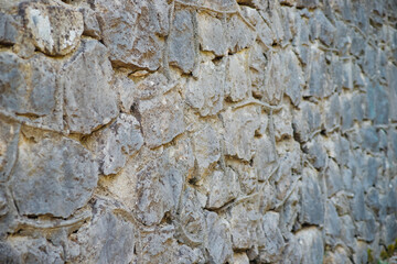 The wall is gray.Abstract background.The texture of a stone wall. A stone wall.