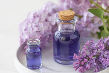 Concept of pure natural organic plant-based ingredients in cosmetology, herbal and flower extract. Lilac for anti-age and anti-acne therapy, gentle face and body skin care