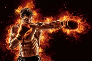 Schilderijen op glas Fighter man punching in fire. MMA fighter © zamuruev