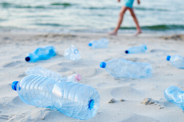 Plastic bottles on sea beach. Environmental pollution by plastic waste