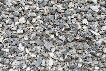 Crushed rock. Texture of gravel stones on ground.