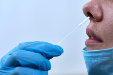 Taking coronavirus nasal swab test in clinic