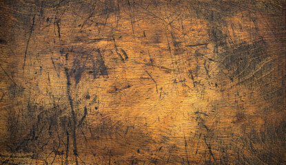 Photo of the texture of an old wooden table. Vintage wood countertop with scratches. Wooden background for text.The structure of an old wooden table.