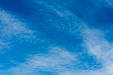 Summer sky. Beautiful blue sky with white clouds. Summer background.