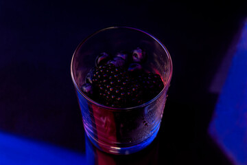 Fruit dessert in a bowl covered with water droplets