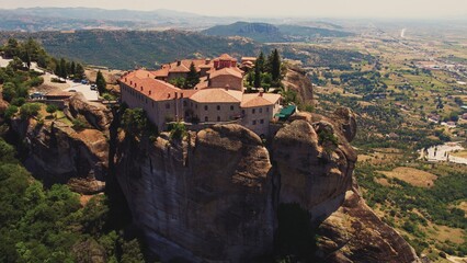 Fototapeta premium Remarkable Greek Orthodox monasteries at Meteora seen from creative aerial perspective. Human achievements. . High quality photo