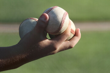 Three Baseballs in Hand - Powered by Adobe