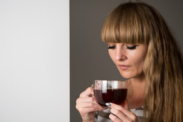 Woman drinking from a mug