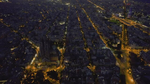 Aerial night view of La Sagrada Fam&iacute;lia Basilica and Barcelona city lights