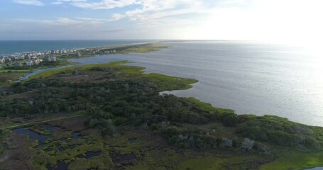 Drone shot of protected areas along the Pamlico Sound in the Outer banks near Frisco, NC with Hatteras in the background