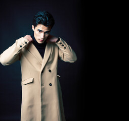 handsome asian fashion looking man posing in studio on black background, lifestyle modern people concept