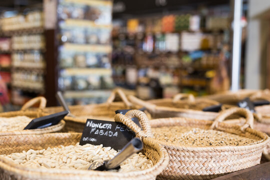 Closeup view on fabada beans in baskets selling on shop. High quality photo