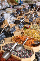 Selling spices at the Shuk Hacarmel street market in Tel Aviv, Israel.