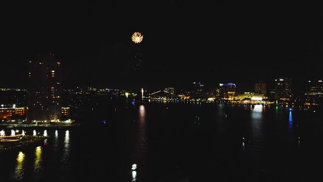 Mesmerizing forward flight into the heart of the July 4th celebration in Norfolk, Virginia.  The night sky is ablaze with large aerial displays of massive fireworks.