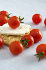 Macro Image of Baby Red Tomatoes with Cracker and Cheese