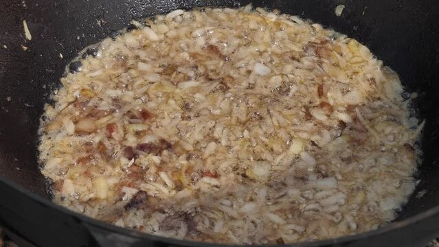 Cossack kulish. onions, meat and lard are cooked in a cast-iron cauldron on fire. The main field porridge of Ukraine