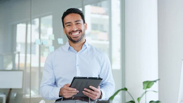 Tablet in the hands of a happy, confident and carefree business man. Smiling in his office, feeling relaxed, positive and working for success. Manager, boss or CEO laughing and planning a strategy
