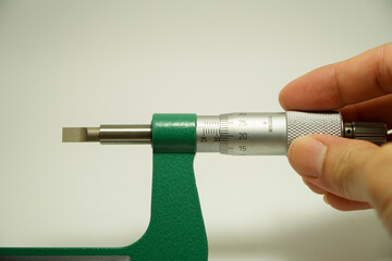 blade micrometer engineer's hand has a non-rotating spindle with a flat blade for the contact...