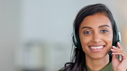 Happy, friendly and smiling face of a call center agent sitting in her office with copy space. Portrait of a female customer service employee wearing a headset with copyspace at her workplace