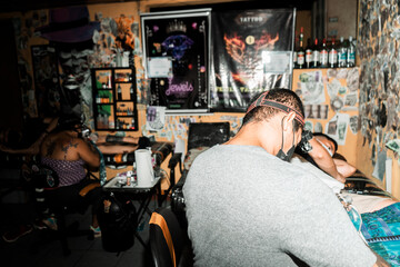 Couple of tattoo artists working in their studio in Managua, Nicaragua