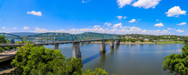 a panoramic shot of the rippling waters of the Tennessee River with the Walnut Street Bridge over...