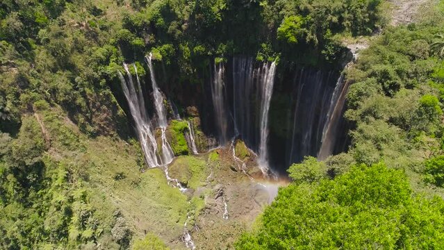 aerial view waterfall coban sewu in Java, indonesia. waterfall in tropical forest by drone Tumpak Sewu aerial footage
