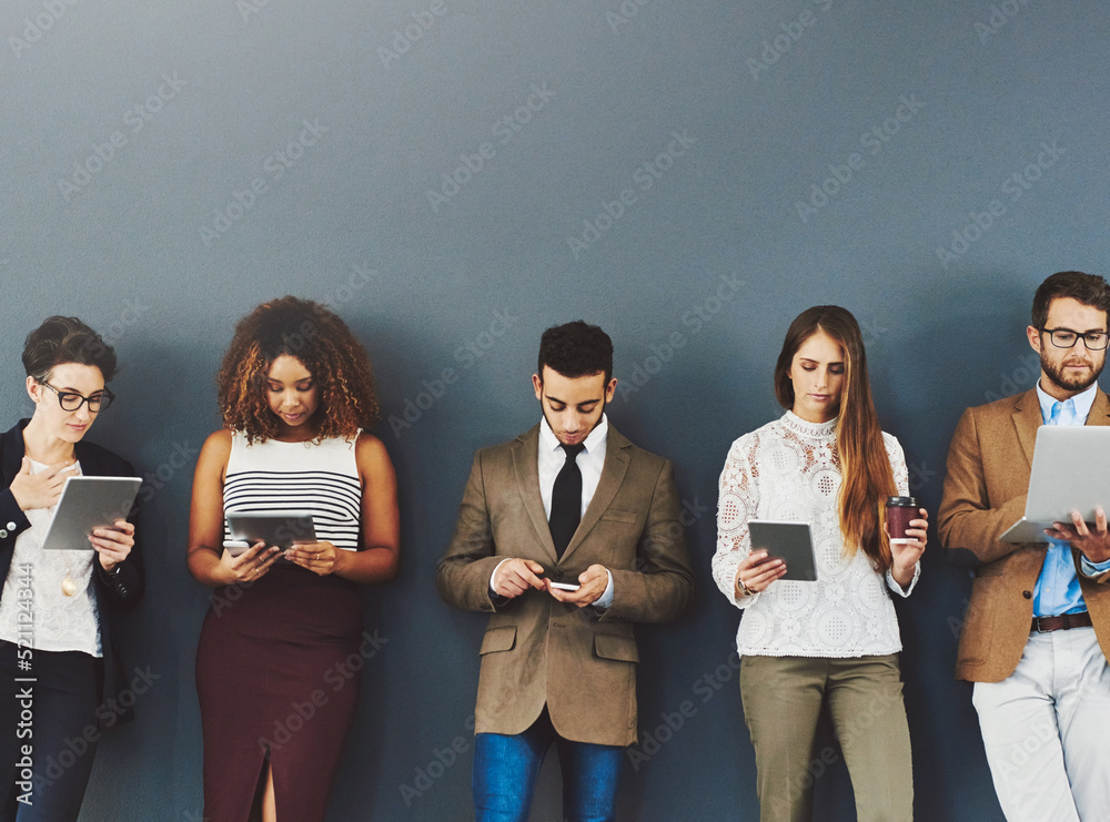Poster Group or team of business people working and browsing with wireless technology in studio against a grey background. Digital marketing colleagues networking online to advertise a startup company