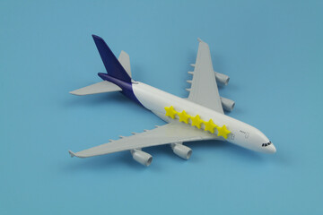 Rating and reputation of airlines company. Airplane with five stars stickers on blue background.	