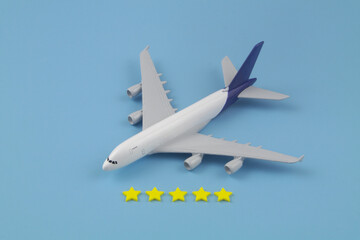 Airlines company feedback. Airplane model with five stars stickers on blue background.	