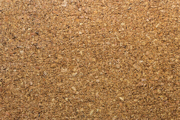 Empty brown cork board for reminders, pins and notes. Office textures and wallpaper