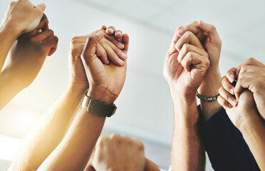 Teamwork, community and support with fists of power, protest hands joined together solidarity....