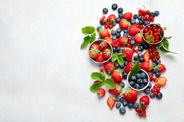 Naklejka na ściany i meble Various fresh berries on neutral background.