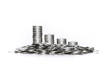 Stack of silver coins on white background. Economic recession and declining income. Investment and...