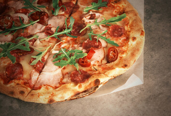 Freshly spicy pizza close-up on the table