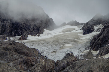 Breathtaking and impressive panoramic view of Glaciar Martial glacier close to Ushuaia, Patagonia in Argentina, enframed by lush vegetation and green trees during summer while hiking