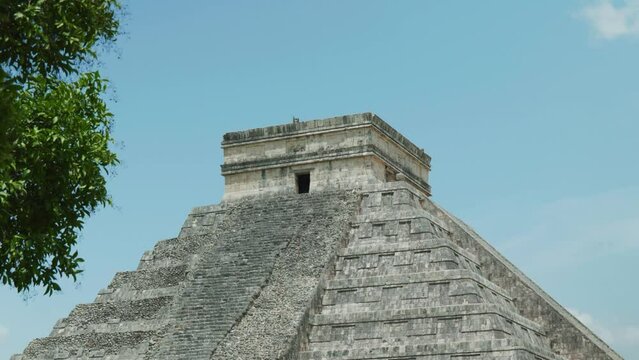 4K Cinematic landscape footage of the Mayan ruins monument of Chich&eacute;n Itz&aacute;, one of the seven wonders, in Yucatan, Mexico on a sunny day.