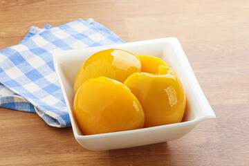 Sweet canned peaches with syrope