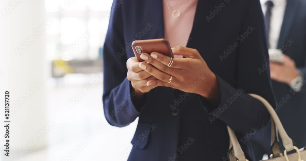 Poster a closeup of a business woman texting on her phone while walking. a professional female corporate ex
