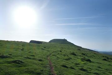green meadow on the peak of mount beriain, with the hermitage of san donato on the summit. Sierra...